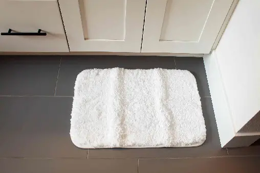thin bath mat to fit under door